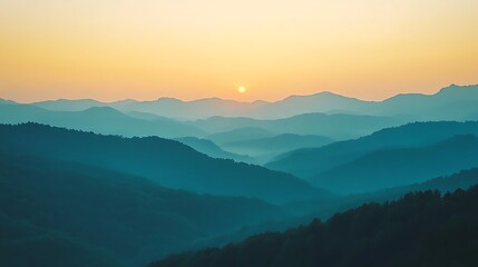Obraz premium Serene Sunrise Over Rolling Mountain Ranges