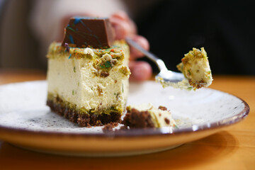 Enjoying a slice of delicious dessert in a cozy cafe setting