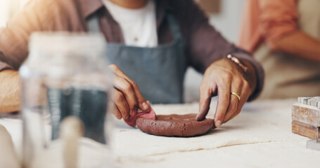 Hands, pottery and person with clay in workshop for artistic process, design or production....