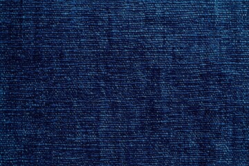 Deep Blue Denim Texture: A close-up shot revealing the rich texture and deep indigo hue of a denim fabric. The image showcases the intricate weave and subtle variations in color.