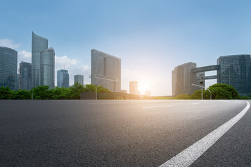 Urban Landscape at Sunset with Modern Skyscrapers and Open Road