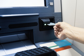 Hand Inserting Card into ATM Machine for Secure Transactions