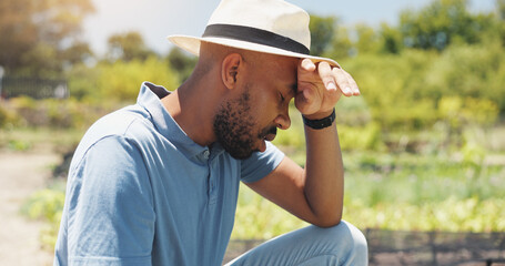 Tired farmer, man and outdoor on field with crops harvest, overworked or headache with fatigue....