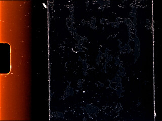 Damaged super 8 film showing dust, scratches and mold on film surface with sprocket holes
