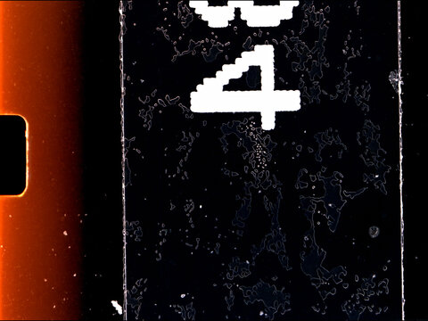 Super 8 film leader showing frame number four, close-up macro shot