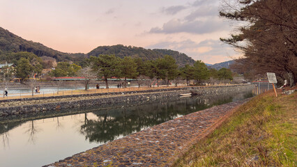 Serene River Walk Along the Katsura River Kyoto Japan Landscape Photography Evening Glow Tranquil Environment