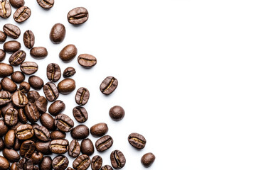 Naklejka premium Fresh coffee beans scattered on white background, showcasing rich textures and colors
