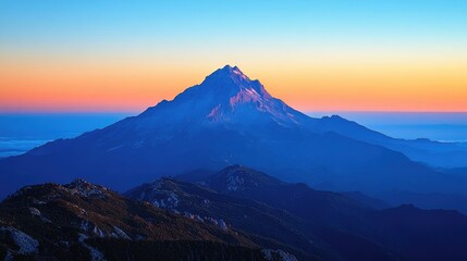 Majestic mountain peak at sunset with vibrant colors over a serene landscape backdrop