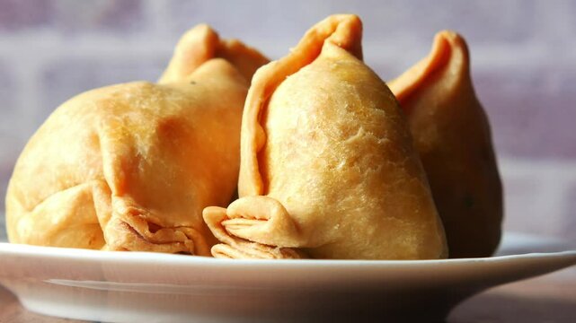 Delicious samosas served fresh at street vendor in the evening