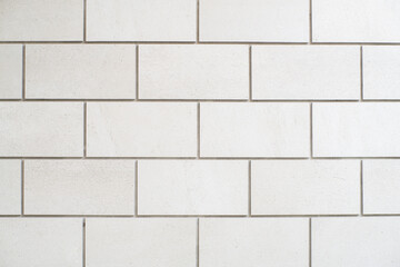 Fototapeta premium Rectangle-shape white stone tile wall texture