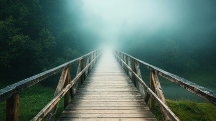 Obraz premium Misty Bridge Over Calm Water Surrounded by Lush Green Forest