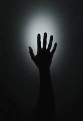 Hand reaching towards light for hope, resilience concept