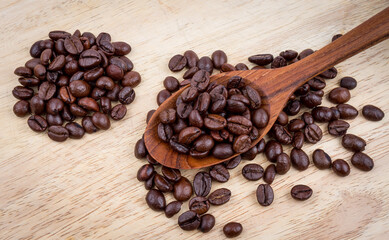 roasted coffee beans on wooden floor