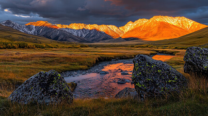 Majestic mountain landscape at sunset with a flowing river and vibrant autumn foliage
