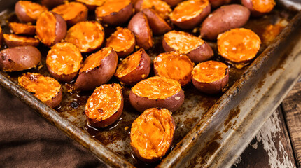 A tray of roasted potatoes with a lot of seasoning on them