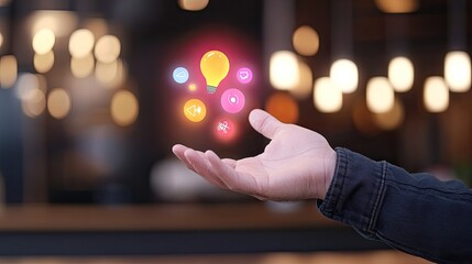 Hand displaying colorful digital icons representing ideas and communication in a modern cafe setting