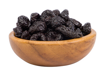 Prunes in wooden bowl isolated on white background.