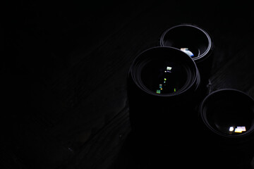 Close-Up of Camera Lenses with Reflections in Dark Lighting