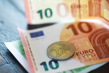 Close-Up of Euro Currency - 2 Euro Coin on 10 Euro Banknotes for Financial and Economic Stock Photography