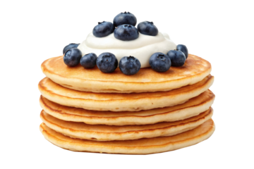 A stack of golden pancakes garnished with whipped cream and fresh blueberries. Concept of breakfast or dessert