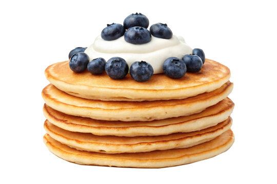 A stack of golden pancakes garnished with whipped cream and fresh blueberries. Concept of breakfast or dessert