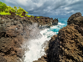Get with me to the Waianapanapa Park and the rough lava cliffs which make the water splash up