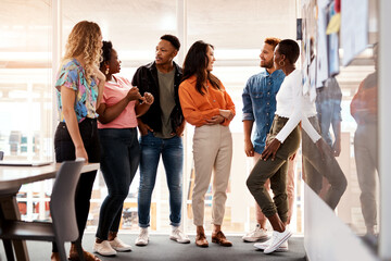 Obraz premium Business people, creative discussion and meeting in office, brainstorming together and support idea. Employees, teamwork and communication for proposal plan in workplace, staff and graphic designers