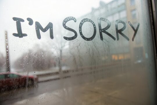 I&rsquo;m sorry written on foggy glass. Apology and regret
