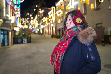 Enchanting Winter Night Stroll with Festive Lights and Cozy Fashion