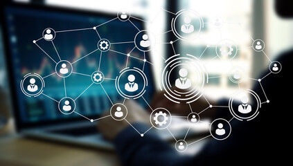 A professional engages in remote tasks while surrounded by digital tools that emphasize connectivity. The workspace highlights a blend of agile leadership and remote automation strategies