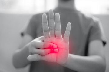 A woman has pain in her wrist. health care concept.