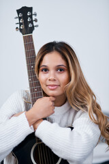 Woman, guitar and happy in bedroom, home and portrait with creative process for album. Girl, person...