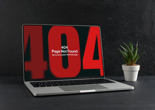 Laptop Showing 404 Error Page Not Found on Black Background