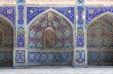 Nadir Divan Beghi Madrasah, a part of Lyabi Hauz madrasa complex, Bukhara, Uzbekistan. Arches with...