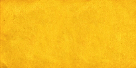 Background with grunge texture of retro paper of yellow color. Horizontal or vertical cardboard texture banner. Old paper vintage texture. Craft eco paper sheet backdrop with rough shabby textured