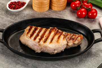 Grilled pork loin steak with bone