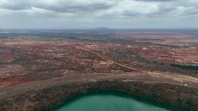 Panoramic aerial view of Kenyan savanna and crater lake Chala
