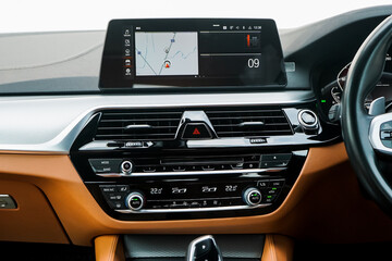 Inside a Brand new hatchback car from the factory with the central display monitor showing the GPS...