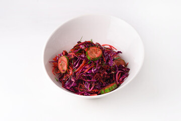 salad of cabbage, carrots and cucumbers. on a white background