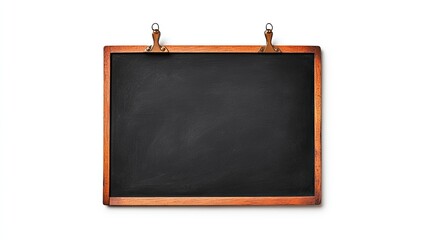 Fototapeta premium Empty blackboard with wooden frame hanging on wall, ideal for educational or creative use