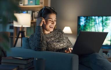 Woman watching movies online on her laptop