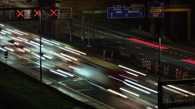 Dense traffic captured in a dynamic long-exposure timelapse on the Antwerp city's R1 ring road in Belgium