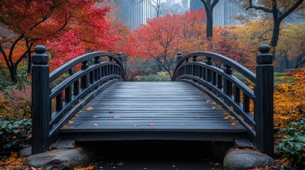 Serene wooden bridge in a vibrant autumn park with colorful foliage and city skyline backdrop