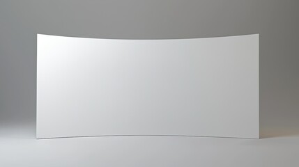 Curved blank display panel in a minimalist studio, ready for creative presentations or displays
