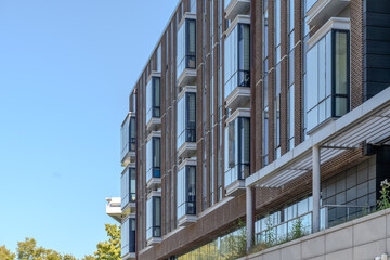 A collection of various exterior windows on buildings, showcasing diverse architectural styles and...