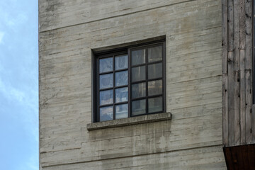 A collection of various exterior windows on buildings, showcasing diverse architectural styles and materials.