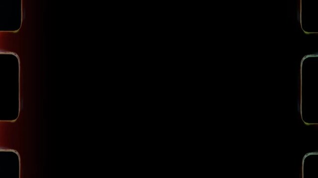 Old film reel burning and melting with sprocket holes