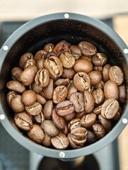 A heap of coffee beans stacked together, ready to be brewed into a delicious cup of coffee.