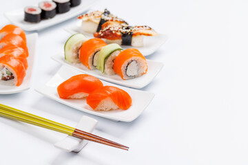 Assorted sushi and maki rolls beautifully arranged on plates