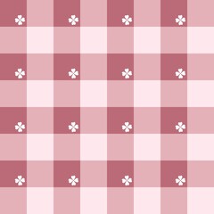Colorful red geometric plaid seamless pattern with white clovers.